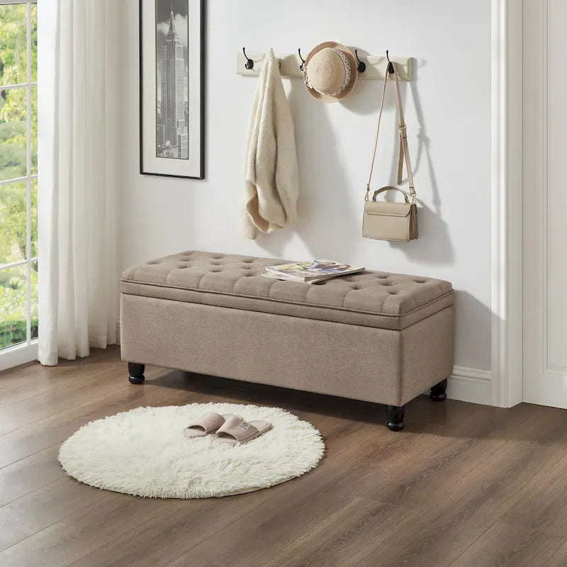 Panca contenitore trapuntata con gambe in legno