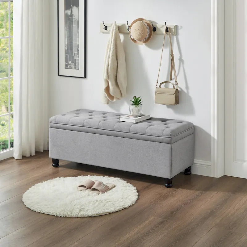 Panca contenitore trapuntata con gambe in legno
