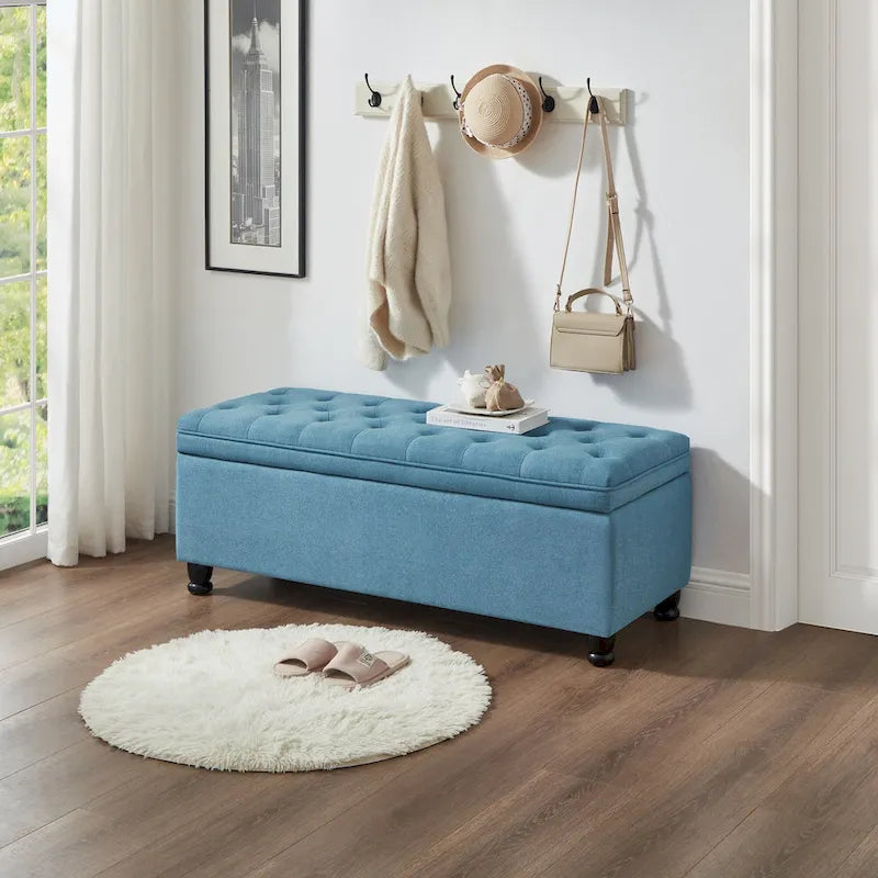 Panca contenitore trapuntata con gambe in legno